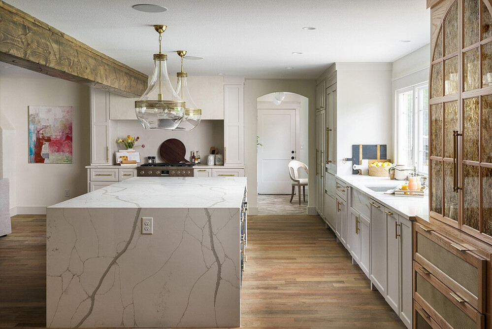 Unique farmhouse/rustic/modern kitchen with taupe and brown details and white countertop with warmer grey veins